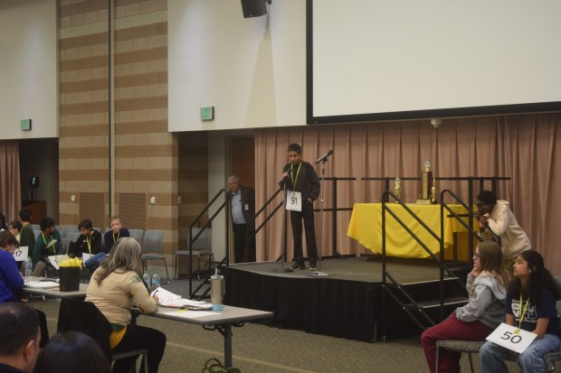 Irhan Ali, a 5th grader at Wattles Elementary in Rochester, correctly spells en masse in the second round. 