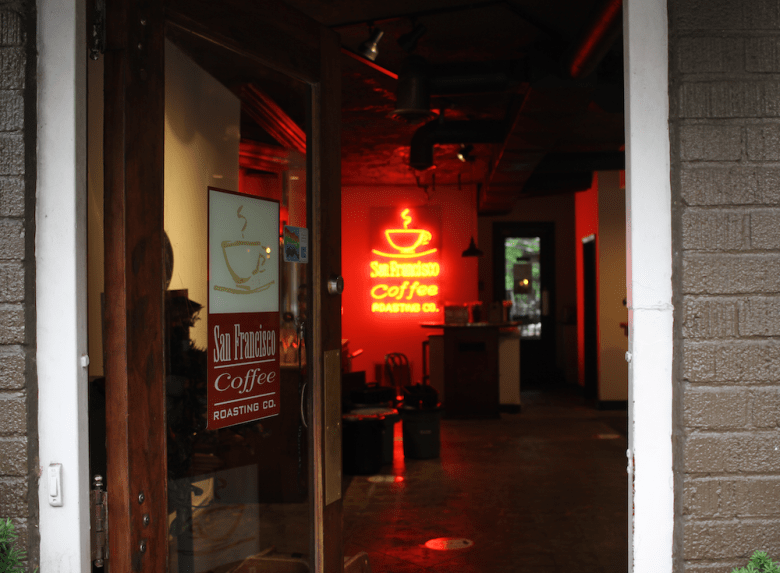 The doorway leading into the Virginia-Highland location with red neon San Francisco Coffee sign. (Photo by Leo Hollen, Jr.)