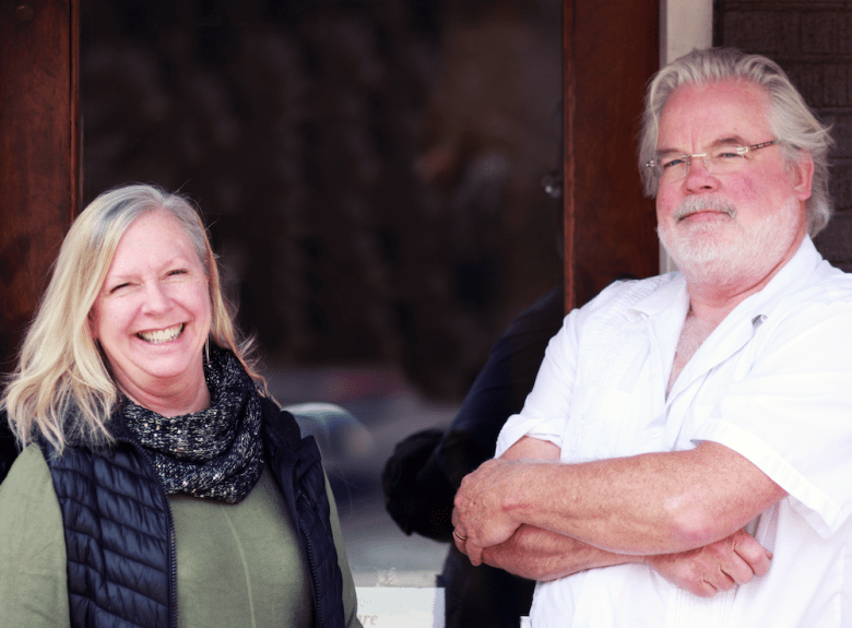 Doug and Tanya Bond, standing in front of San Francisco Coffee in Virginia-Highland