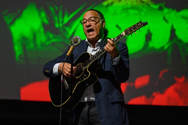 Bob Reid sings a song on stage during a public celebration honoring the life and legacy of Betty Reid Soskin held at Calvin Simmons Theatre in Oakland, Calif., on Sunday, March 1, 2026. Bob Reid is the son of Betty Reid Soskin. Soskin passed away last year at the age of 104 and was known for being the oldest National Park Service ranger assigned to the Rosie the Riveter World War II Home Front National Historical Park in Richmond. (Jose Carlos Fajardo/Bay Area News Group)