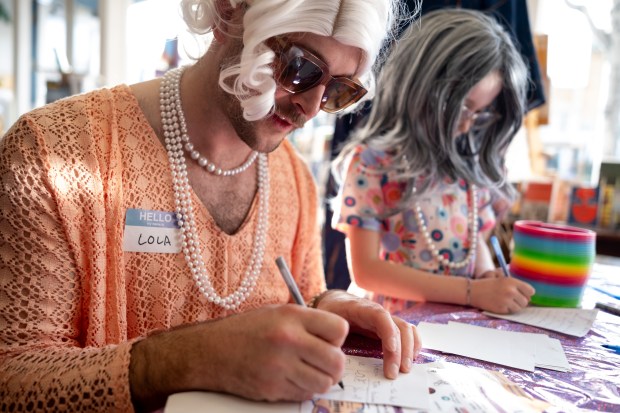 Granny Lola (left) writes a Cinquain Poem inside Books Inc. on Park Street during the 2nd Annual GrannyCon in Alameda, Calif., Saturday, March 07, 2026. The lighthearted event is a fundraiser for breast cancer research, education and legislation. GrannyCon was formed by a group of moms during the Coronavirus Pandemic of 2020. (Douglas Despres / for the Bay Area News Group)