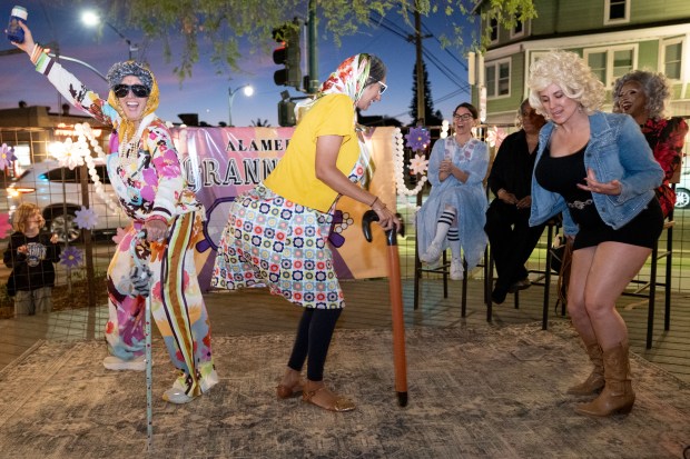 Contestants for "Most Imaginative Icon" dance onstage at Park Station during the GrannyCon 2026 Afterparty event in Alameda, Calif., Saturday, March 07, 2026. The lighthearted event is a fundraiser for breast cancer research, education and legislation. GrannyCon was formed by a group of moms during the Coronavirus Pandemic of 2020. (Douglas Despres / for the Bay Area News Group)