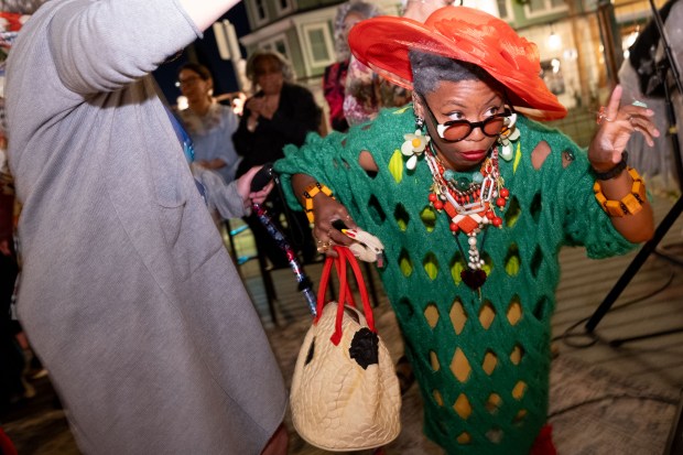 Melan Allan (right) dances onstage moments before winning the "Ms. GrannyCon 2026" award during the GrannyCon 2026 Afterparty at Park Station in Alameda, Calif., Saturday, March 07, 2026. The lighthearted event is a fundraiser for breast cancer research, education and legislation. GrannyCon was formed by a group of moms during the Coronavirus Pandemic of 2020. (Douglas Despres / for the Bay Area News Group)