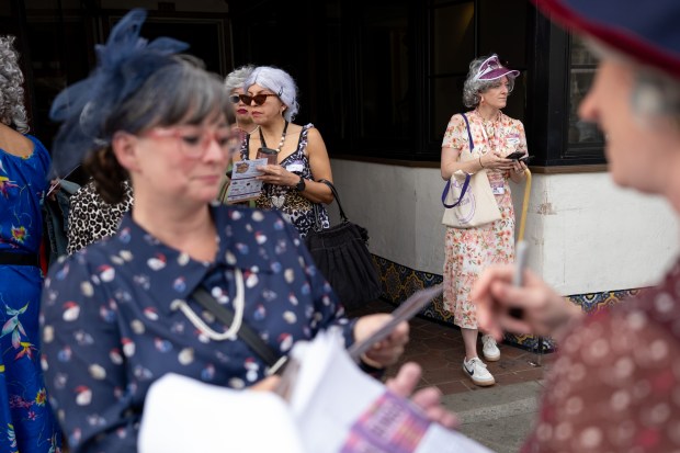 A group of granny's outside of Tucker's Ice Cream on Park Street during the 2nd Annual GrannyCon in Alameda, Calif., Saturday, March 07, 2026. The lighthearted event is a fundraiser for breast cancer research, education and legislation and was formed by a group of moms during the Coronavirus Pandemic of 2020. (Douglas Despres / for the Bay Area News Group)