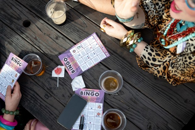 Details of Bingo cards and beers on a picnic table outside of Scolari's on Park Street during the 2nd Annual GrannyCon in Alameda, Calif., Saturday, March 07, 2026. The lighthearted event is a fundraiser for breast cancer research, education and legislation. GrannyCon was formed by a group of moms during the Coronavirus Pandemic of 2020. (Douglas Despres / for the Bay Area News Group)