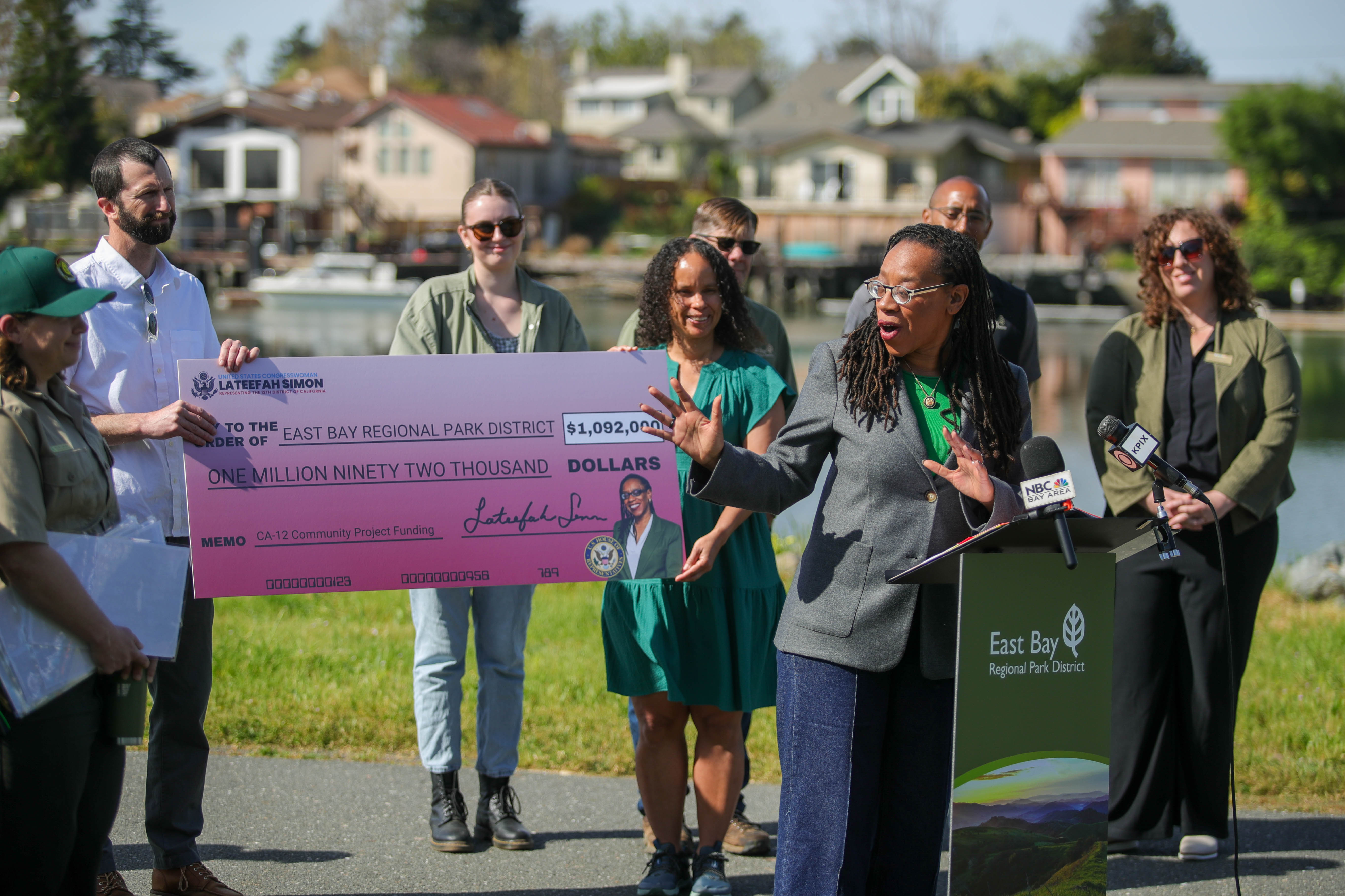 Congresswoman Lateefah Simon speaks after delivering a federal check for...