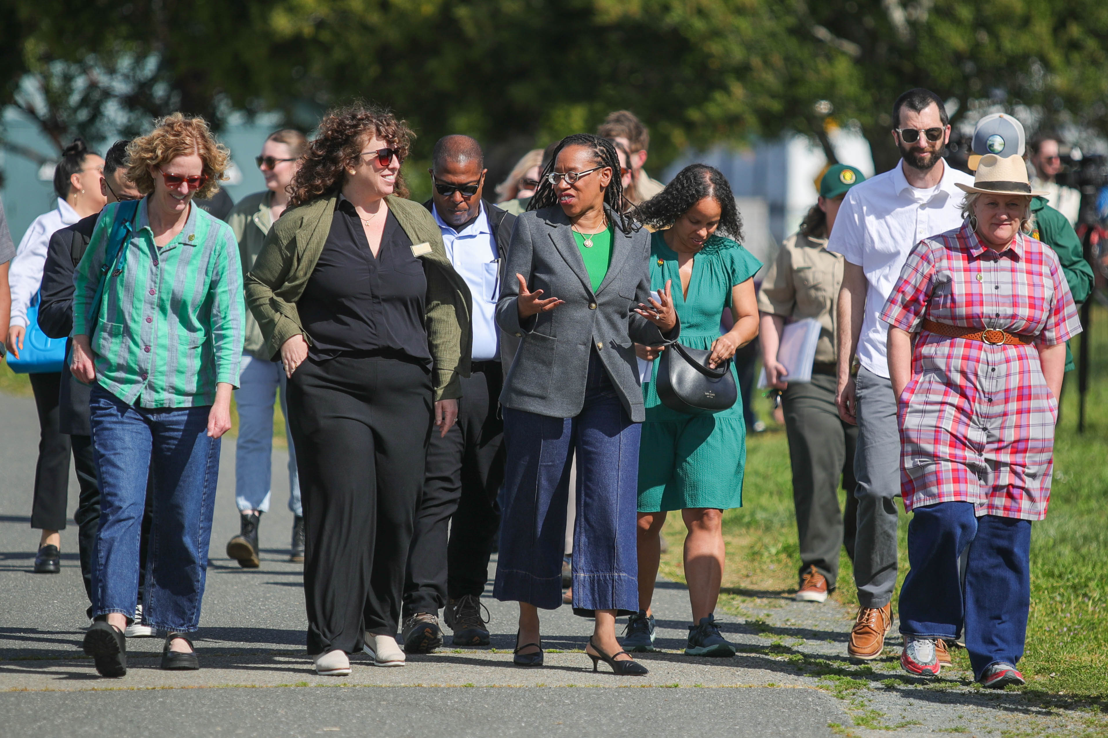Congresswoman Lateefah Simon, center, tours the planned Tidewater renovation along...