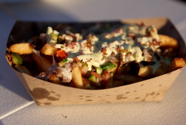 Persian French fries are served during the Persian New Year Festival on Durant Avenue in Berkeley, Calif., on Tuesday, March 17, 2026. (Jane Tyska/Bay Area News Group)