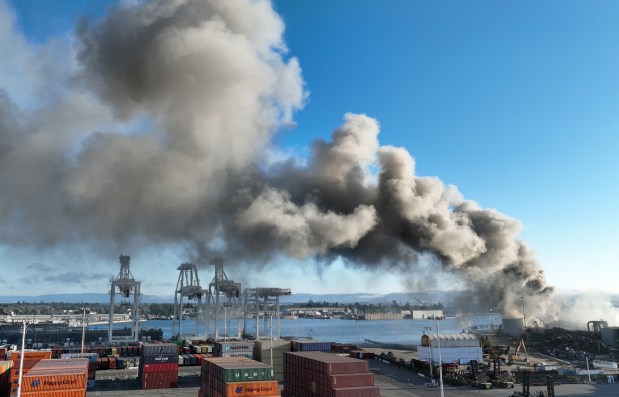 Oakland firefighters battle a fire at the Schnitzer Steel plant at the Port of Oakland in Oakland, Calif., on Wednesday, August 9, 2023. (Jane Tyska/Bay Area News Group)