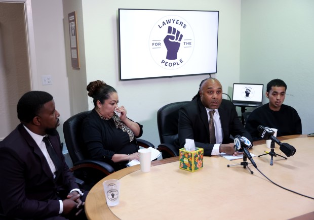 Attorney Marlon Monroe speaks during a press conference at the Lawyers for the People office in Oakland, Calif., on Tuesday, March 17, 2026. To the right is Imer Mendez, son of Jose De Jesus Mendez, and to the left is Rosa Hernandez, wife of Mendez. Far left is attorney Adanté Pointer. Mendez was shot and killed by Richmond police on Feb. 4, 2025 after holding a knife sheath. (Jane Tyska/Bay Area News Group)
