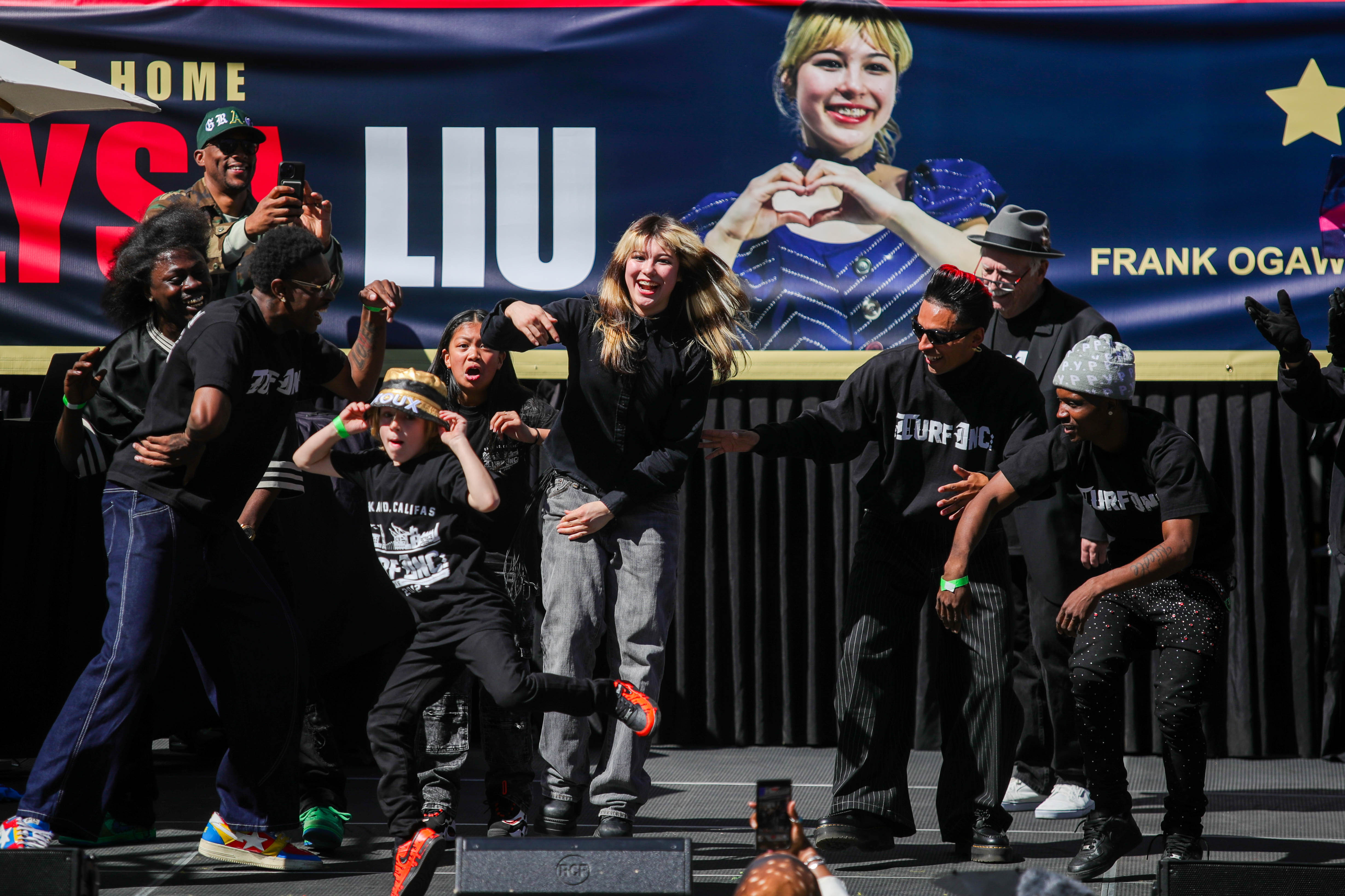 Olympic gold medalist figure skater Alysa Liu, middle, dances as...