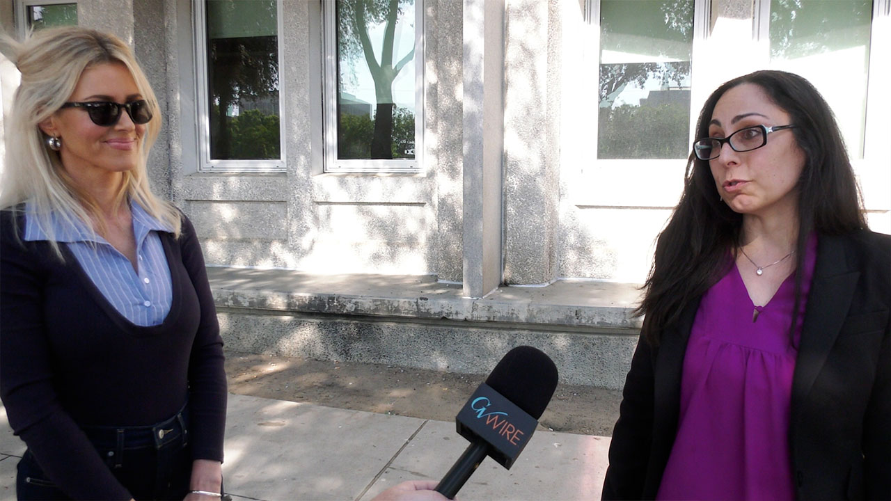 Image of Elizabeth Arambula with her attorney 