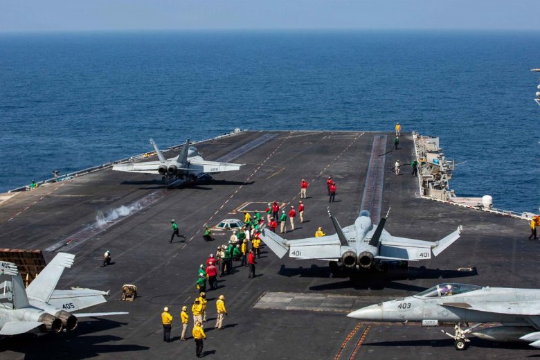 F-18 Super Hornets prepar to launch