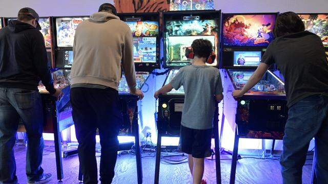 Pinball fans play the eight games assembled at Summer Fox for Fresno Flip or Fail Pinball Club's pinball pop-up Saturday, Dec. 6, 2025 in Clovis.