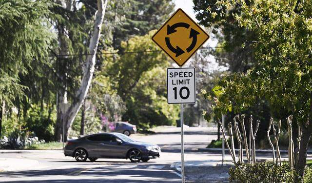 A car negotiates a roundabout on southbound North Wishon Avenue at East Cortland Avenue on Thursday, March 12, 2026 in Fresno.