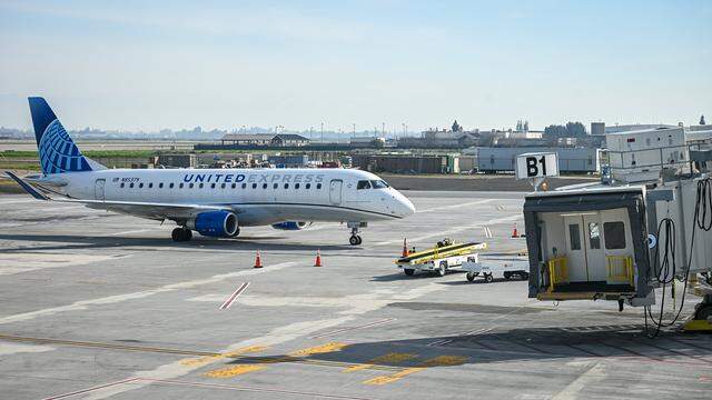 A commercial jet arrives at one of the new Concourse B passenger boarding bridges, part of a $150 million terminal expansion at Fresno Yosemite International on Tuesday, Jan. 13, 2026.