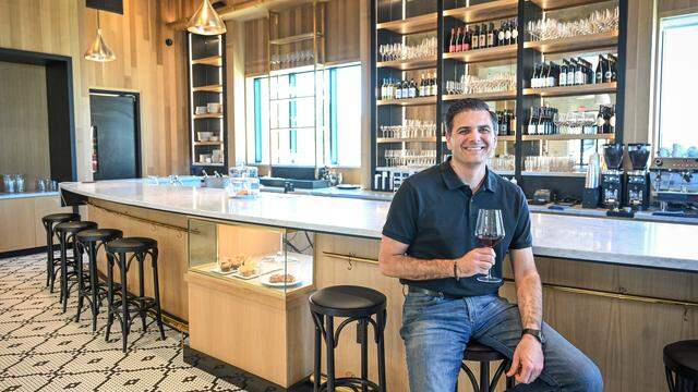 Vincent Ricchiuti, one of the family owners of Il Caffè, a cafe within Enzo's Table in northwest Clovis, sits in the cafe's extensive bar area with a glass of their featured Italian wines. The cafe, located in The Avenue complex at Willow and Shepherd, serves traditional Italian espresso drinks, coffee, baked goods as well as wine. 
