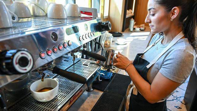 Kylie Adanalian prepares a latte at Il Caffè, a cafe within Enzo's Table at Willow and Shepherd in northwest Clovis serving traditional Italian espresso drinks, coffee and baked goods. 