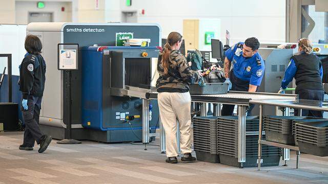 TSA agents work the security station at Fresno Yosemite International Airport on Tuesday afternoon, March 10, 2026.