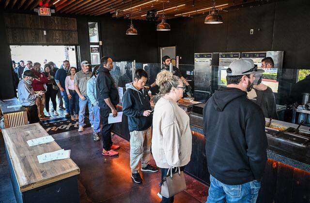 Lunchtime visitors wait in line at the counter inside Horn Barbecue in Fresno's Granite Park shopping center on Friday, Jan. 23, 2026. The long-anticipated barbecue restaurant opened on Tuesday, Jan. 20.