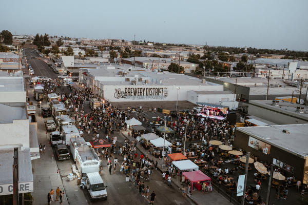 Aerial view of Brewery District with streets full of people and food trucks