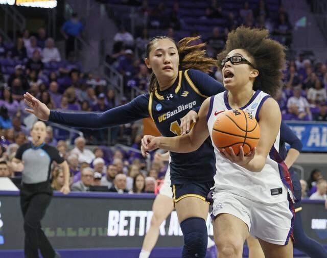 TCU guard Olivia Miles (5) puts up a shot against UC San Diego guard Sabrina Ma (15) during the first half of an NCAA Division I Women's Basketball Championship game at Schollmeier Arena in Fort Worth, Texas, Friday, March, 20, 2026.