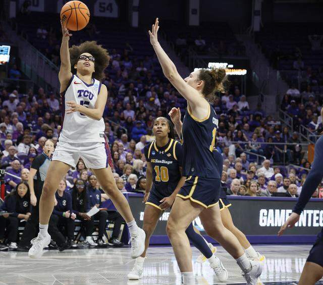 TCU guard Olivia Miles (5) hooks one over the UC San Diego defense during the first half of an NCAA Division I Women's Basketball Championship game at Schollmeier Arena in Fort Worth, Texas, Friday, March, 20, 2026.