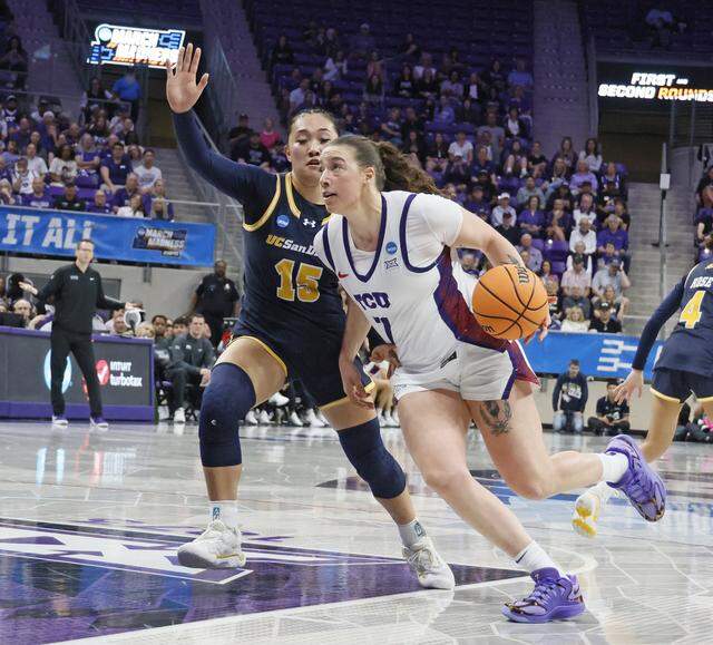 TCU forward Marta Suarez (7) drives into the paint defended by UC San Diego guard Sabrina Ma (15) during the first half of an NCAA Division I Women's Basketball Championship game at Schollmeier Arena in Fort Worth, Texas, Friday, March, 20, 2026.
