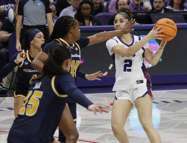 TCU guard Veronica Sheffey (2) attempts to get out of a UC San Diego triple team during the first half of an NCAA Division I Women's Basketball Championship game at Schollmeier Arena in Fort Worth, Texas, Friday, March, 20, 2026.