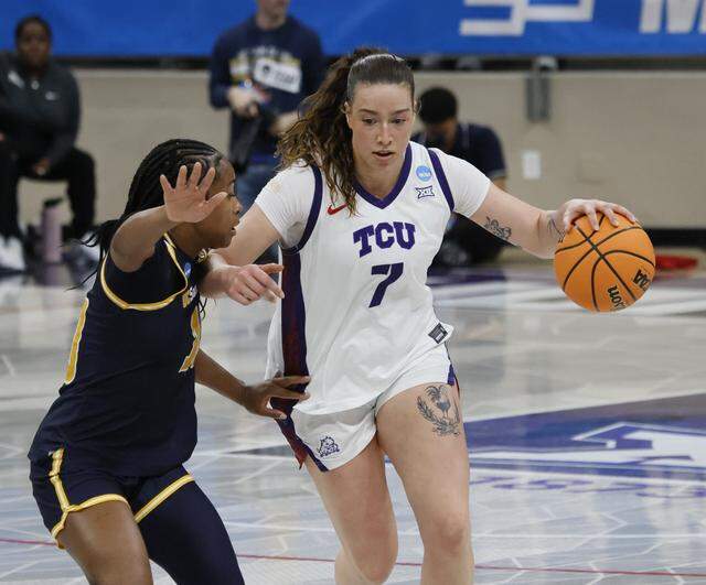 TCU forward Marta Suarez (7) drives against UC San Diego guard Dymonique Maxie (10) during the first half of an NCAA Division I Women's Basketball Championship game at Schollmeier Arena in Fort Worth, Texas, Friday, March, 20, 2026.
