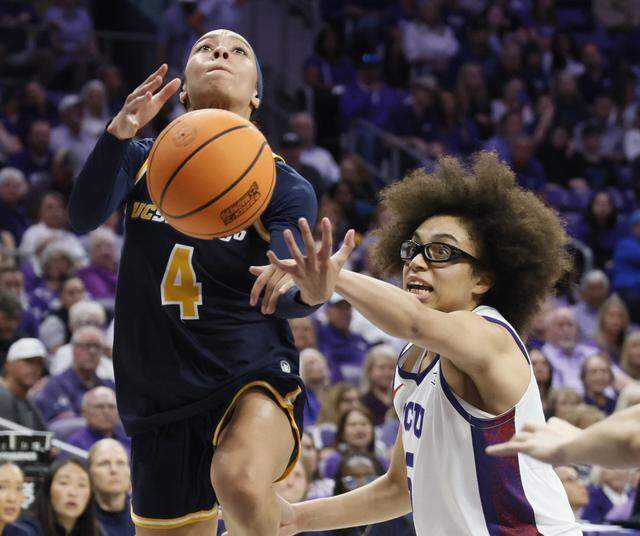 TCU guard Olivia Miles (5) defends and fouls UC San Diego guard Makayla Rose (4) during the second half of an NCAA Division I Women's Basketball Championship game at Schollmeier Arena in Fort Worth, Texas, Friday, March, 20, 2026.