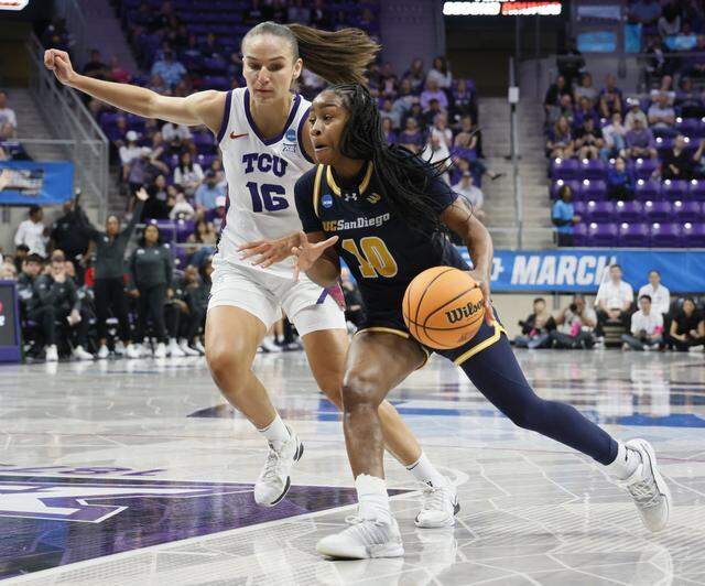 UC San Diego guard Dymonique Maxie (10) tries the defense of TCU guard Clara Bielefeld (16) during the second half of an NCAA Division I Women's Basketball Championship game at Schollmeier Arena in Fort Worth, Texas, Friday, March, 20, 2026.