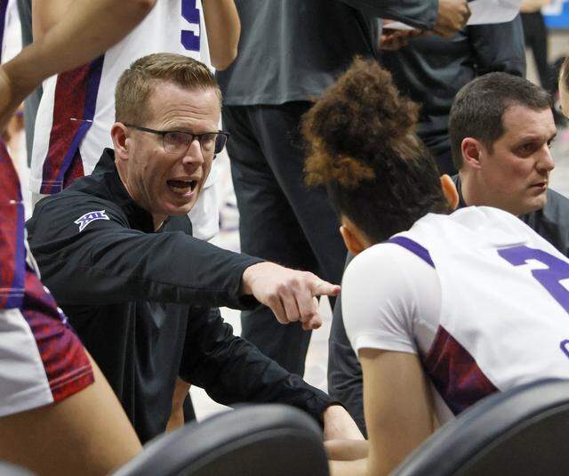 TCU head coach Mark Campbell gives guard Veronica Sheffey (2) instructions during a time out against UC San Diego in the second half of an NCAA Division I Women's Basketball Championship game at Schollmeier Arena in Fort Worth, Texas, Friday, March, 20, 2026.