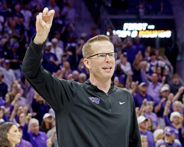 TCU head coach Mark Campbell celebrates his teams win against UC San Diego with fans after an NCAA Division I Women's Basketball Championship game at Schollmeier Arena in Fort Worth, Texas, Friday, March, 20, 2026.