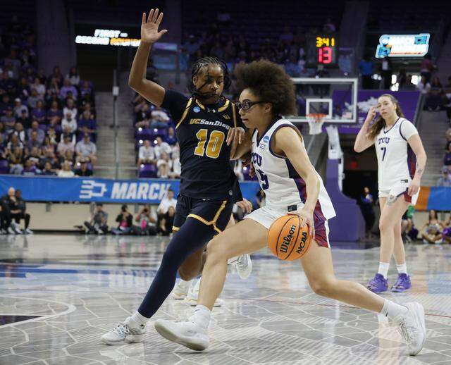 TCU guard Olivia Miles (5) drives against UC San Diego guard Dymonique Maxie (10) during the first half of an NCAA Division I Women's Basketball Championship game at Schollmeier Arena in Fort Worth, Texas, Friday, March, 20, 2026.