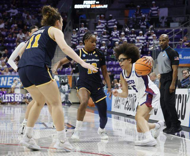 UC San Diego center Erin Condron (11) and guard Dymonique Maxie (10) attempt to box TCU guard Olivia Miles (5) into the corner during the first half of an NCAA Division I Women's Basketball Championship game at Schollmeier Arena in Fort Worth, Texas, Friday, March, 20, 2026.