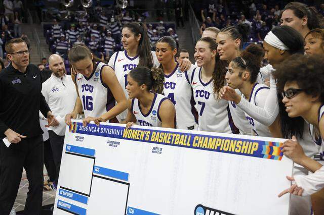 The Horned Frogs pose with the championship bracket that shows them moving on to the Sweet 16 after defeating Washington in a second round NCAA Division I Women's Basketball Championship game at Schollmeier Arena in Fort Worth, Texas, Sunday, March, 22, 2026.