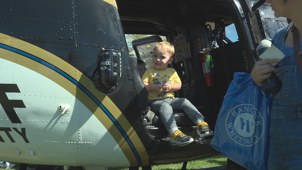 Kids were able to explore fire trucks, police cars, military vehicles and equipment from local...
