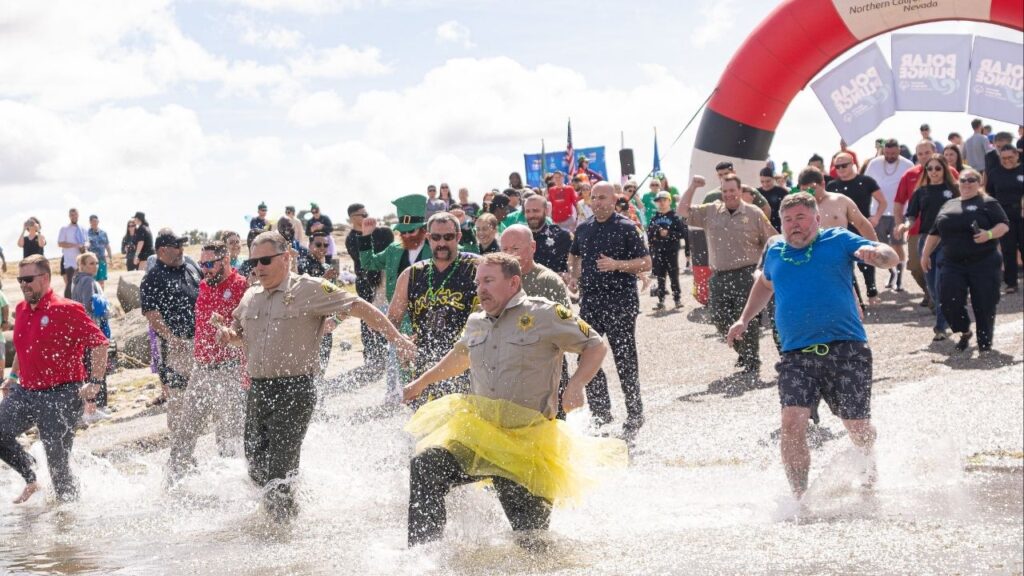 Fresno County Sheriff John Zanoni and another officer lead the way, in style, into the 2025 Fresno Polar Plunge. (Northern California Special Olympics)