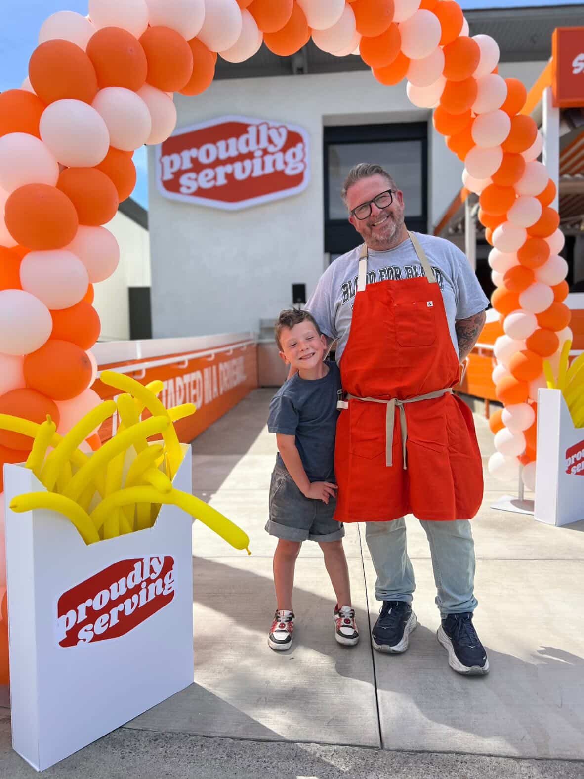 Matthew McIvor and his son Owen celebrate the opening of...
