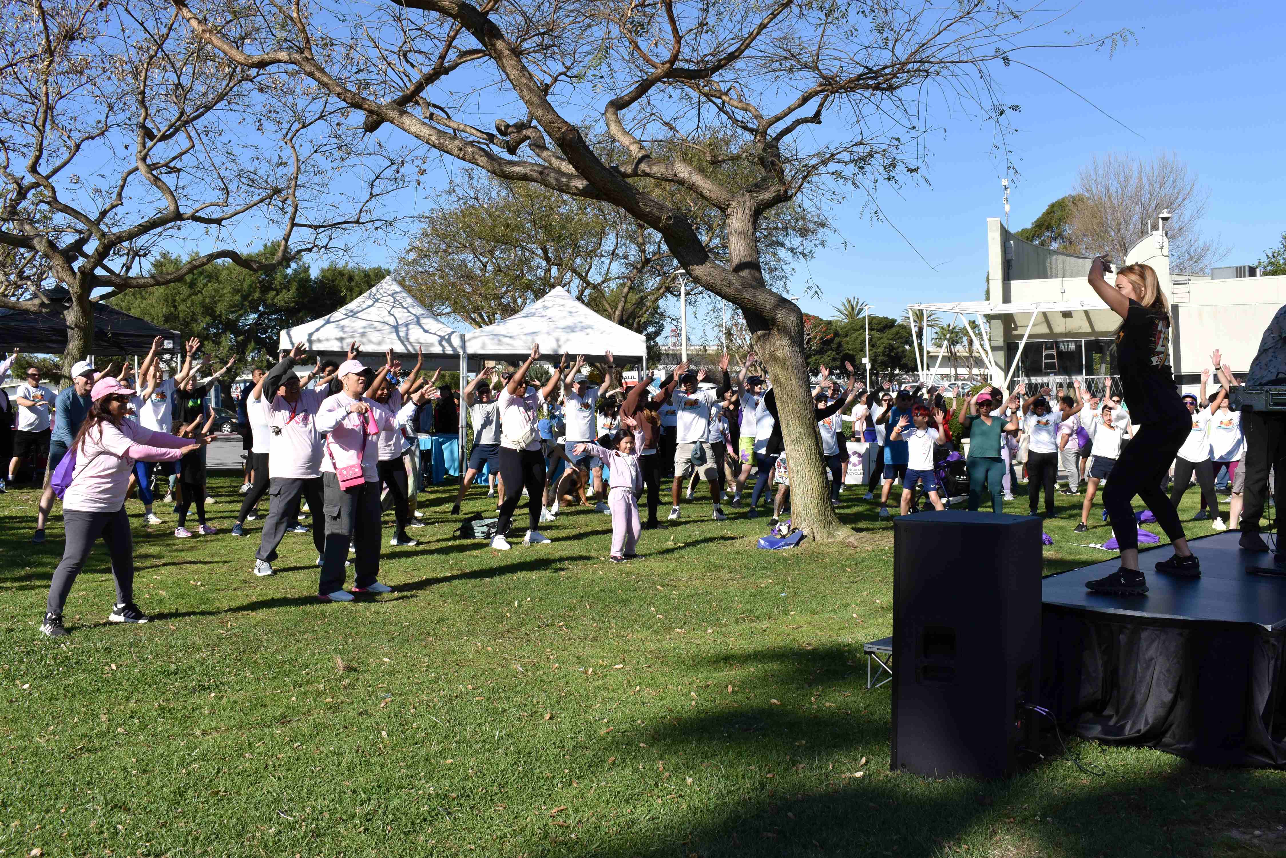 Participants warm up before the event as ElectriKIDS leads a...