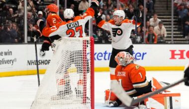 Flyers wing Noah Cates (left) celebrates his game-winning goal with Matvei Michkov against the Ducks in overtime.