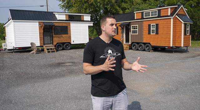 Marcus Stoltzfus talks in 2019 about tiny homes on wheels built at Liberation Tiny Homes in Leola, Penn.