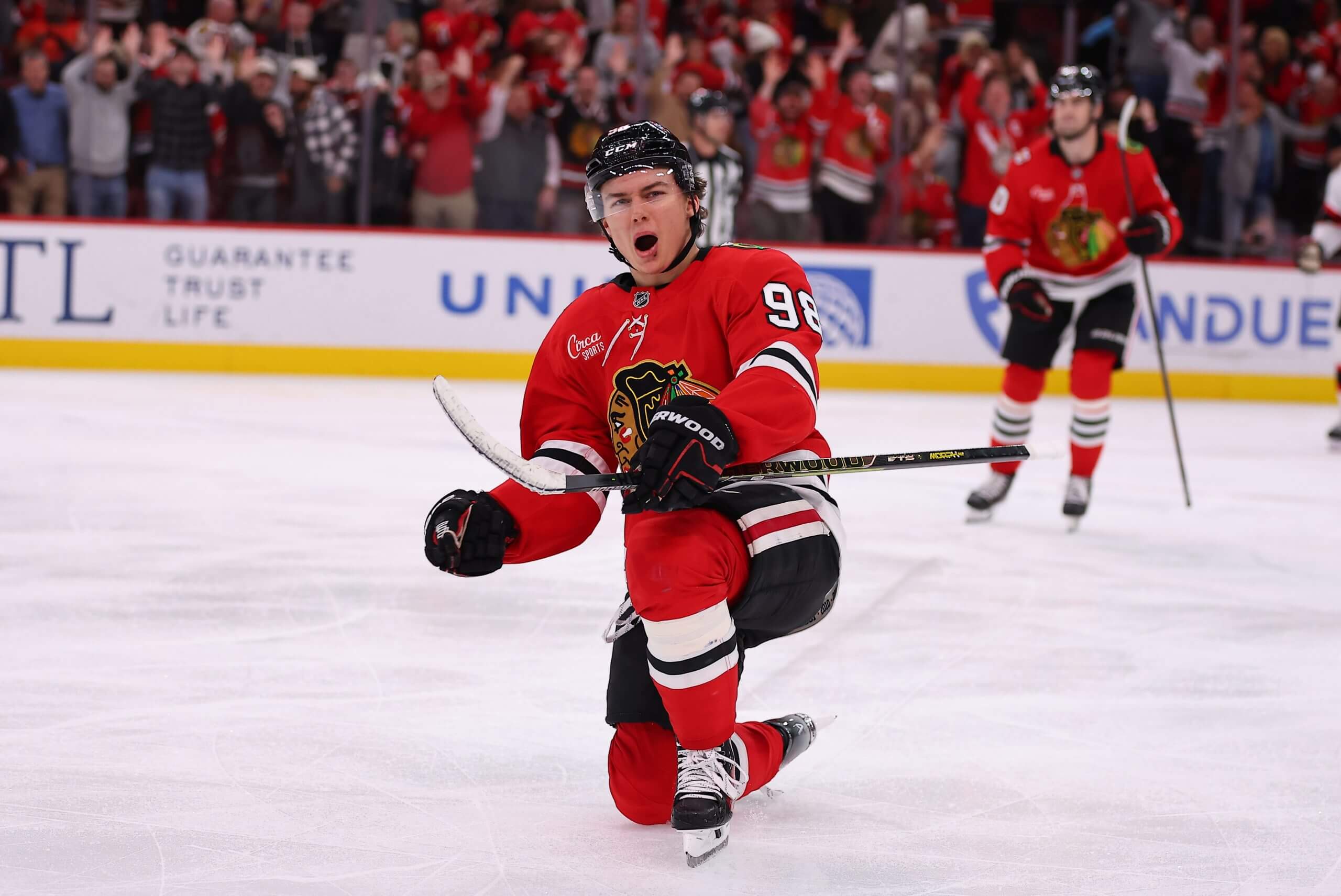 Connor Bedard, in a red jersey, celebrates a goal in an October 2025 game. 