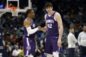 NEW ORLEANS, LOUISIANA - FEBRUARY 09: Russell Westbrook #18 of the Sacramento Kings and Maxime Raynaud #42 speak during a break during the first half of a game against the New Orleans Pelicans at Smoothie King Center on February 09, 2026 in New Orleans, Louisiana. NOTE TO USER: User expressly acknowledges and agrees that, by downloading and or using this photograph, User is consenting to the terms and conditions of the Getty Images License Agreement. (Photo by Tyler Kaufman/Getty Images)