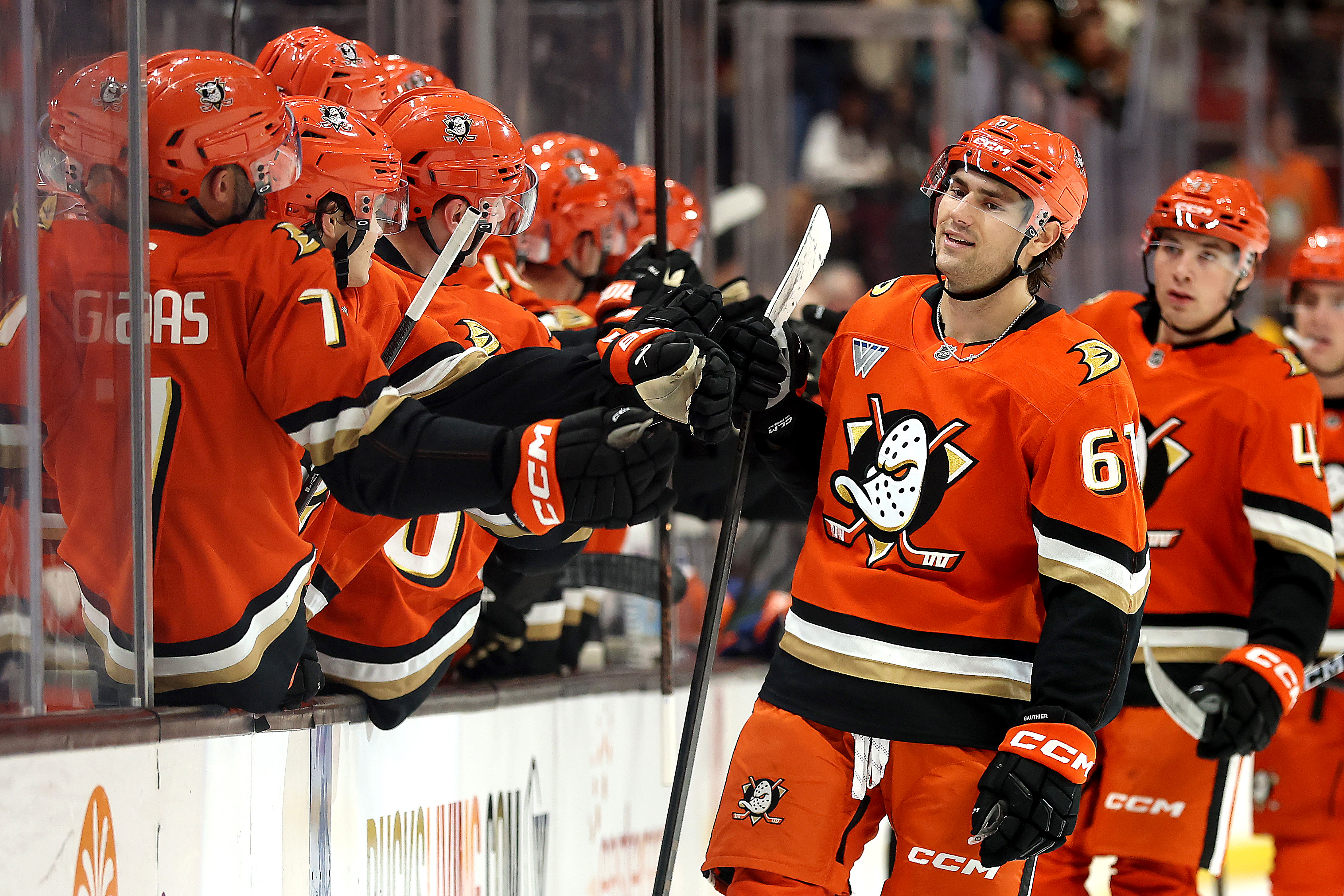 The Ducks’ Cutter Gauthier is congratulated at the bench after...