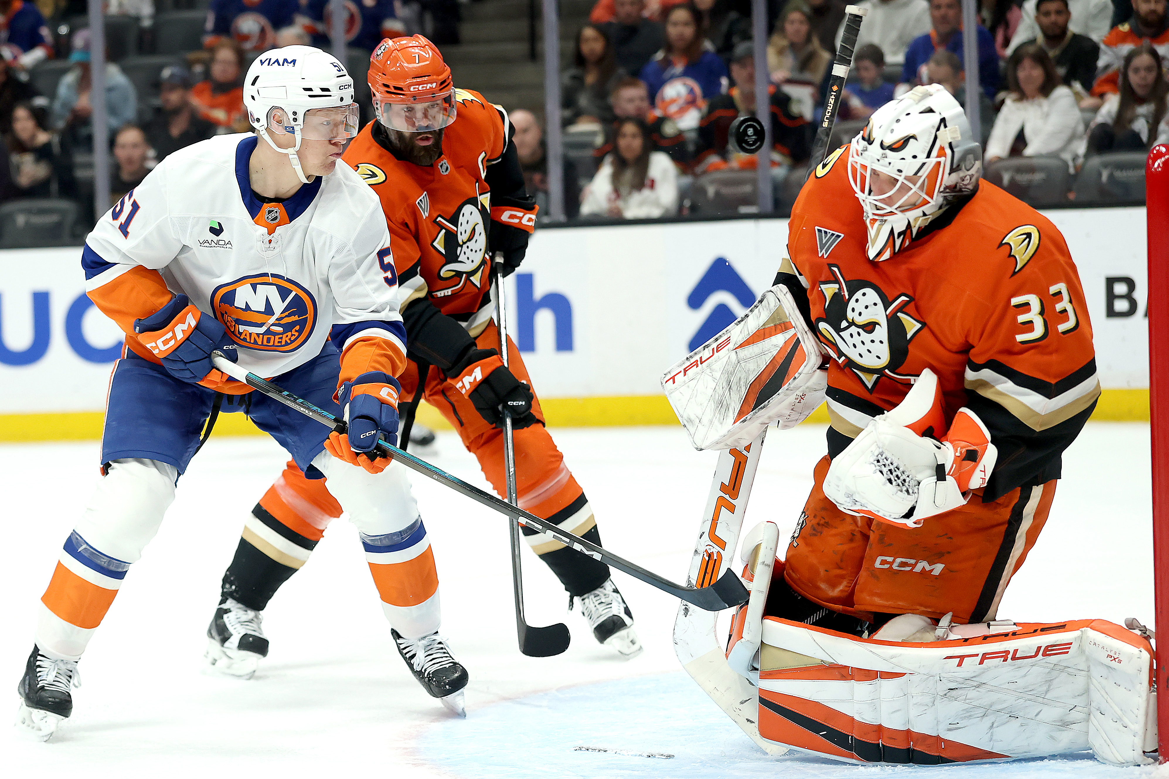 The New York Islanders’ Emil Heineman (51) tips a shot...