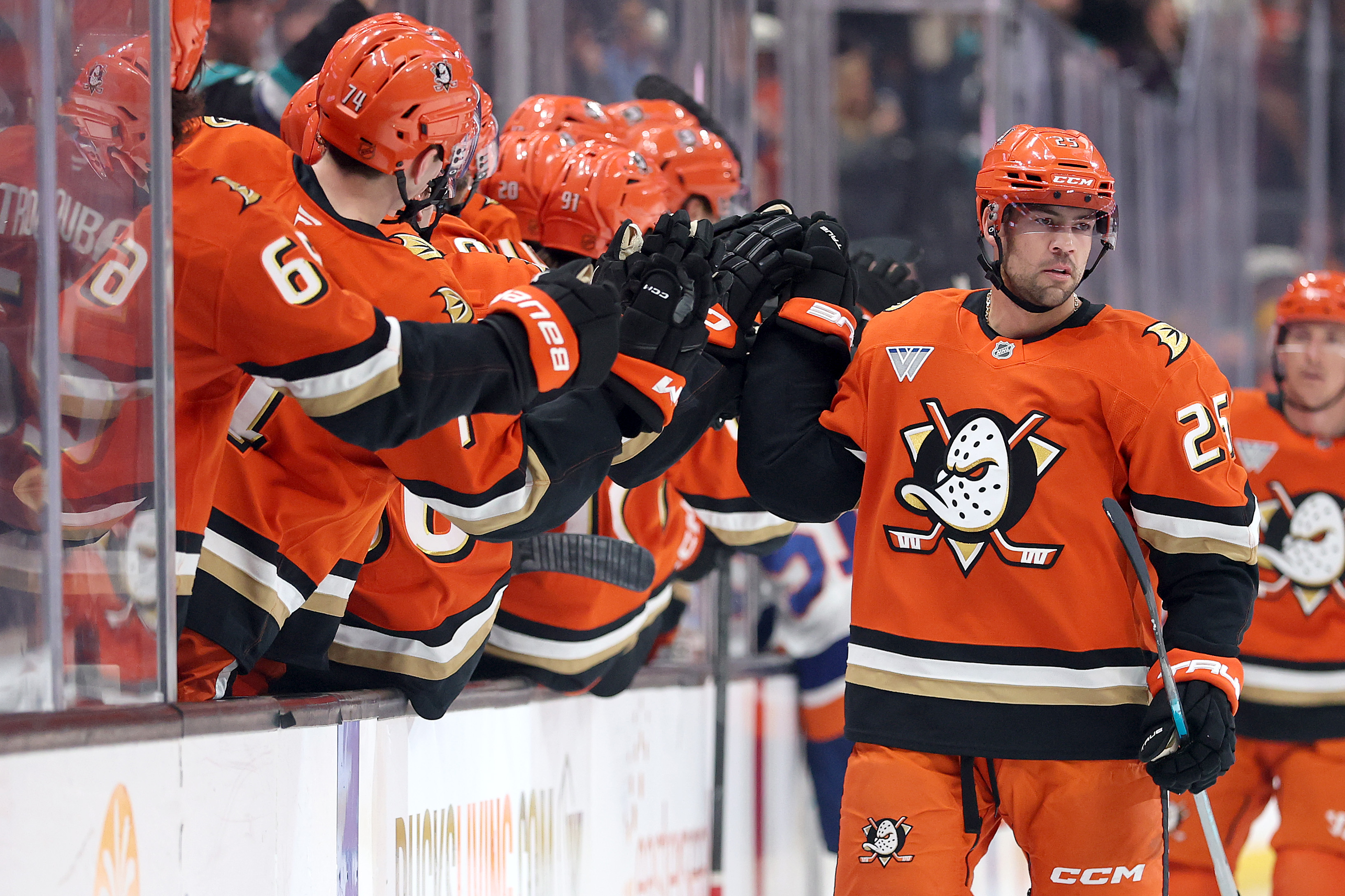 The Ducks’ Ryan Poehling is congratulated at the bench after...