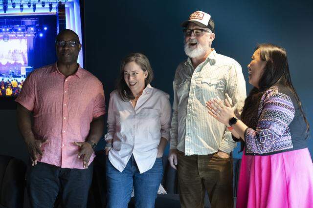 John McCrea, singer of the band Cake, center, meets with congressional candidates Mai Vang, right, and Effie Phillips-Staley, center left, and former U.S. Representative Jamaal Bowman, left, before a benefit concert hosted by the two campaigns and Cake at Channel 24 in Sacramento on Sunday, March 22, 2026.