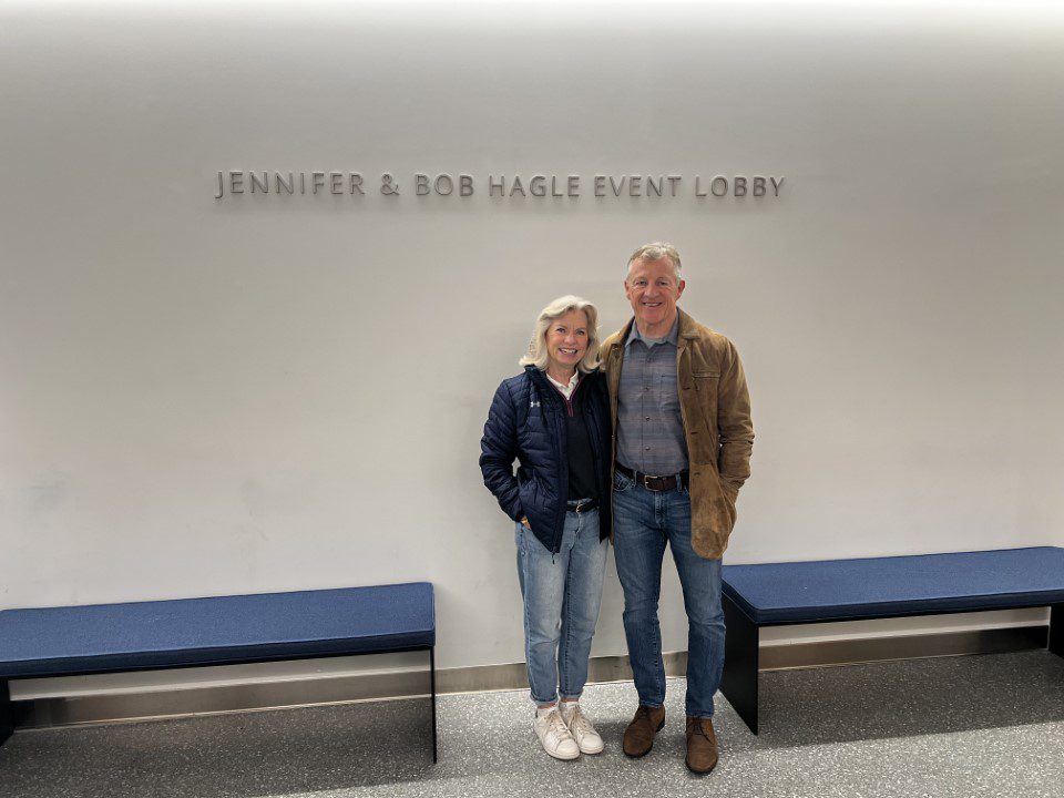 Jennifer and Bob Hagle pictured in front of Jennifer & Bob Hagle Event Lobby, the 198 McAllister St. building lobby named in their honor.